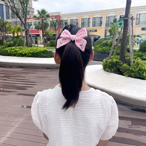 Kids pink checkered hair bow clip, cute preppy style hair accessory for girls daily wear.