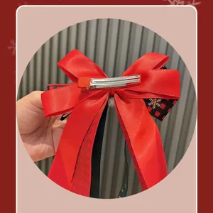Christmas red bow hair clip for kids, stylish plaid ribbon hair accessory with metal clip.