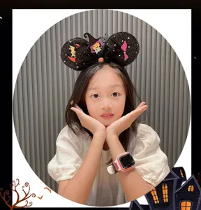 Close-up details of the Halloween children mouse ears headband with witch hat and glitter bow.
