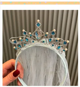 Detailed close-up of girls blue ice princess rhinestone crown mesh veil headband feature.