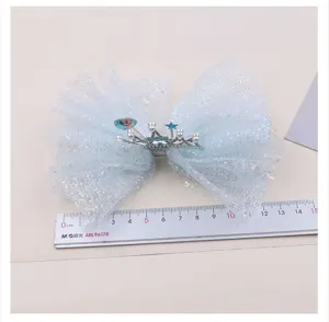 Girls blue mesh bow hair clip with rhinestone crown and princess Elsa charm for kids.