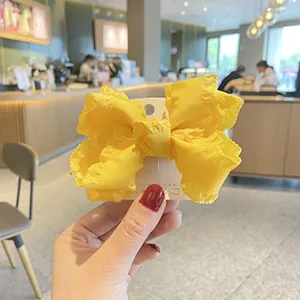 Cute yellow fabric bow hair clip for kids, ruffles design side hair pin for daily sweet styling.
