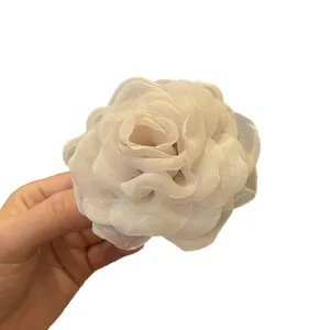 Handmade white organza camellia flower hair accessory DIY material for wedding dress decor.