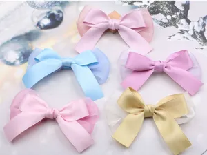 Delicados pasadores de pelo para niños con tul dulce y lazos de satén para looks encantadores.