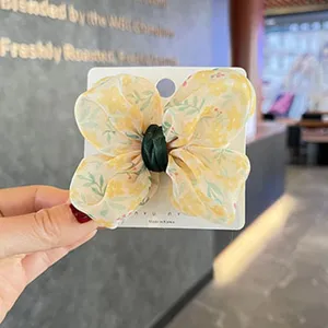 Jolie pince à cheveux nœud papillon floral pour filles, barrette papillon en mousseline jaune.