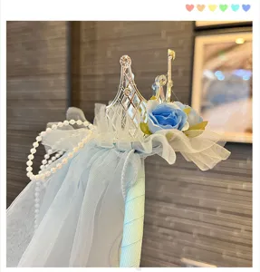 Kids princess crown headband with blue veil, artificial flowers and pearl decorations for parties.