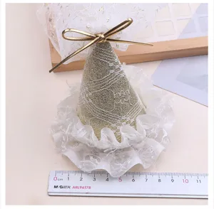 Children conical party hat with gold lace veil and bow detail for birthday photography