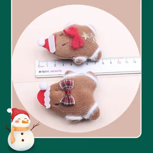 Christmas gingerbread man hair clips detail shot, plush hair accessories, cute winter kids decor.