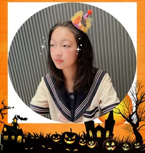 Halloween mini hair clip detail view, cute tulle and bat decoration for kids holiday dress up.