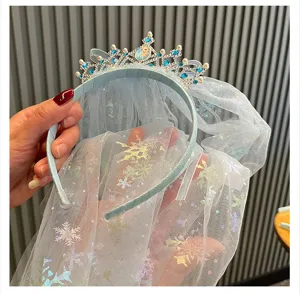Detailed close-up of the blue rhinestone crown veil hairband, showcasing delicate mesh details.