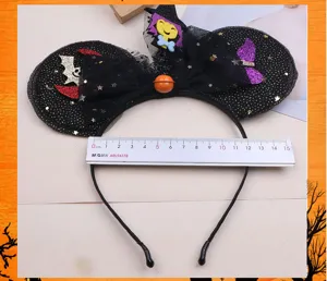 Halloween party hair hoop with black mesh bow, glitter ears and spooky bat decoration.