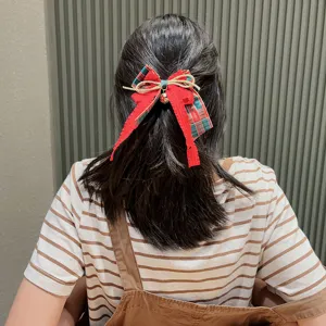 Christmas red and green hair bow clip with cute bells, festive hair accessories for girls.