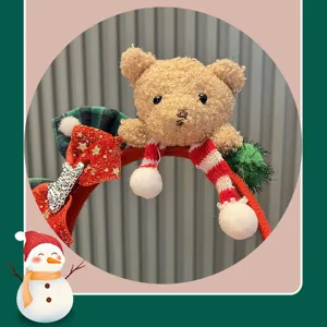 Christmas teddy bear plush headband detail, cute holiday photo prop for kids and toddlers.