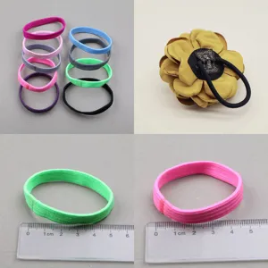 Colorful elastic hair ties and fabric flower hair accessories set for women and DIY styling.