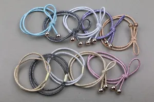 Detailed view of sparkling hair ties with metal beads and colorful elastic ropes for daily use.