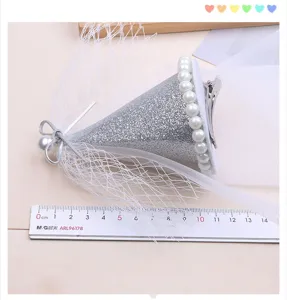 Kids mini top hat hair clip with silver glitter cone, white mesh veil and pearl trim for party.