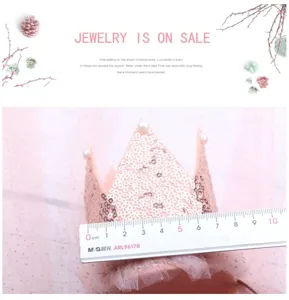 Kids pink sequin crown detail shot, sparkling mesh hair accessory for birthday party and dress up.