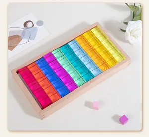 Detailed view of colorful translucent acrylic cube building blocks in wooden storage box tray.
