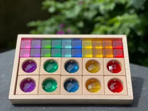 Acrylic translucent building blocks set with colorful rainbow crystal cubes in wooden box.