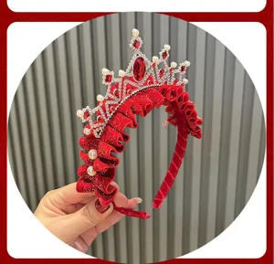 Red velvet tiara headband detail featuring rhinestones and pearls for festive girls.