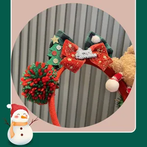 Children Christmas headband with cute teddy bear and pom-pom, perfect festive party hair accessory.
