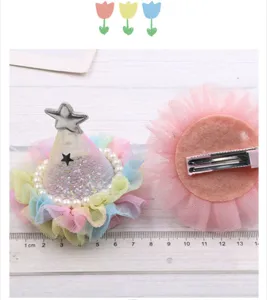 Detail shot of children mesh party hat hair clip with pearls and star for girls daily wear.
