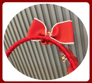 Red kids hairband with a cute bow, delicate tassel, and cherry blossom bell charm.