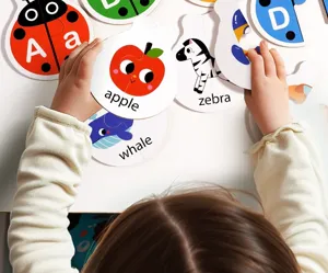 Close-up detail of kids educational alphabet puzzle cards matching animal and fruit words.