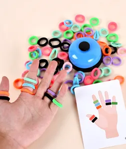 Details of kids ring tossing game showing colorful elastic bands on fingers and a matching bell.