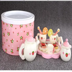 Wooden afternoon tea toy set for kids with pink strawberry storage bucket and cups.