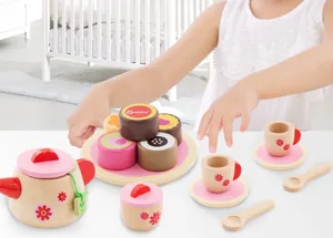 Wooden afternoon tea toy set detail showing exquisite miniature cups, teapot, and colorful cakes.