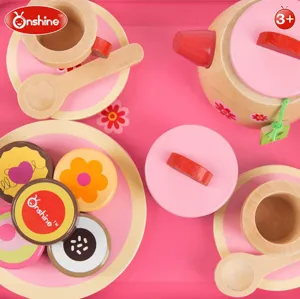 Wooden afternoon tea toy set detail view, featuring cute cups, teapot and mini cakes for kids.