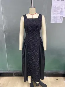 Elegant black sleeveless midi dress with floral embossed texture for autumn fashion.
