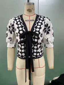 Black and white floral print short sleeve V-neck cardigan detail view for summer fashion.