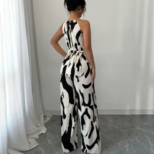 Elegant summer backless halter neck black and white cow print jumpsuit for women.