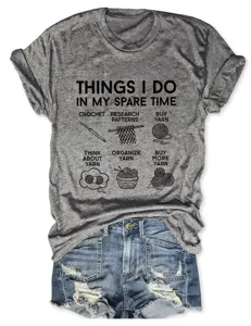 Grey short sleeve t-shirt with funny crochet yarn print and round neck detail view.