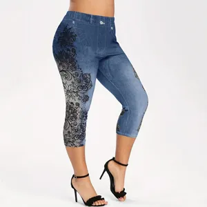 Detail view of women's printed faux denim capri leggings with black lace floral side patterns.