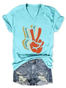 Detailed view of the stylish women's V-neck short sleeve t-shirt with retro peace hand graphic.