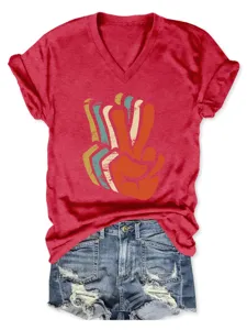 Women V-neck short sleeve T-shirt with retro peace hand graphic and chic denim shorts detail.