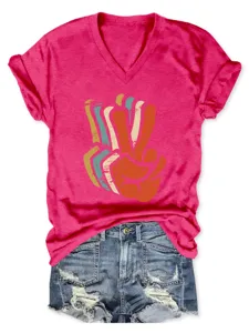 Detailed view of women's short-sleeve V-neck t-shirt with trendy vintage hand gesture graphic.