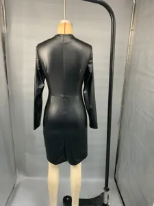 Back detail view of a black faux leather long sleeve bodycon dress showcasing slim fit design.