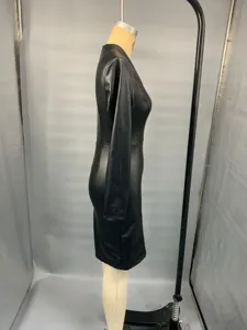 Black faux leather long sleeve dress side view detail showing slim fit and V neck design.