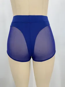 Detail shot showing the back view of blue high-waist mesh patchwork tight yoga shorts.