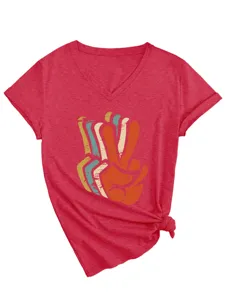Close-up detail view of red V-neck short sleeve t-shirt featuring retro peace sign print and knot hem.