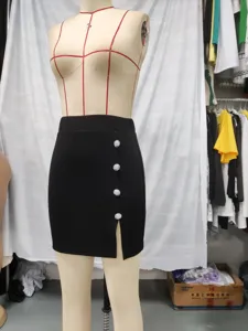 Women black high waist mini skirt with chic silver buttons and side slit, stylish.