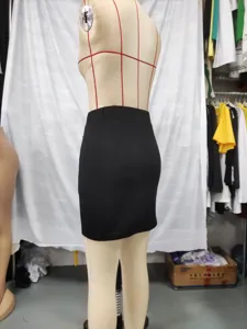 Black high-waisted mini skirt side view detail shot, simple solid color slim fit design.