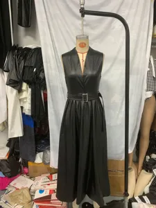 Women's black faux leather sleeveless V-neck maxi dress with stylish belt for autumn fashion.
