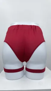 Back view of red high-cut hot pants with leg garters displayed on mannequin detail shot.