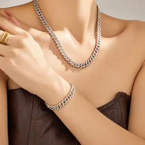 Close-up detail view of luxury cubic zirconia Cuban link necklace and matching bracelet set.