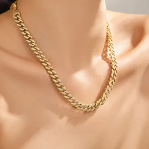 Close-up detail of luxury gold-plated stainless steel cuban link necklace with cubic zirconia.